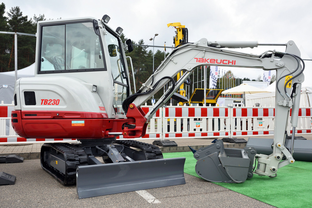 White and red Takeuchi Amphibious Excavator